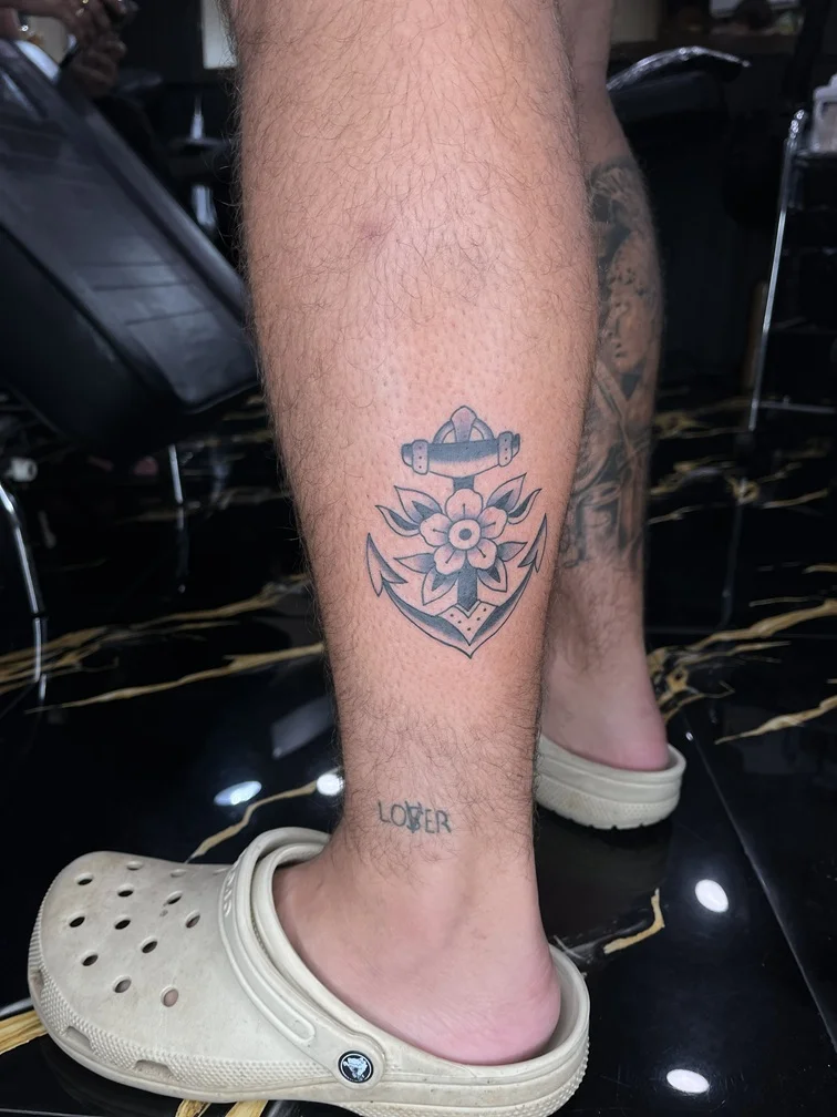 traditional oldschool black man foot tattoo elegant dotwork symbol tattoo canggu bali