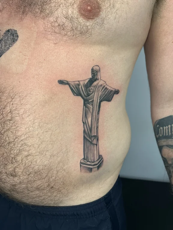 religious realism man linework spiritual bold line heavy shading dotwork tattoo Canggu Bali