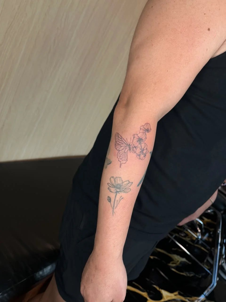 man hand butterfly surrealism animal fine line line work line flower tattoo canggu bali