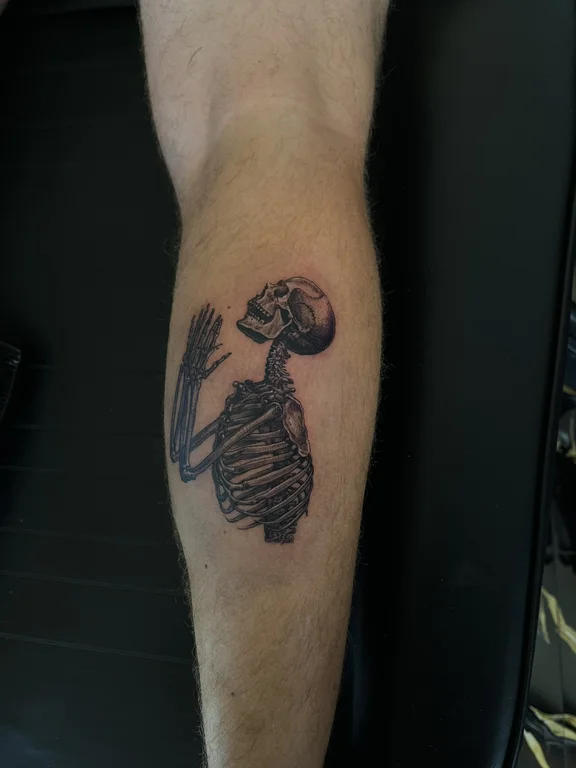 skull surreal man black grey horror fine line linework heavy shading tattoo Canggu Bali