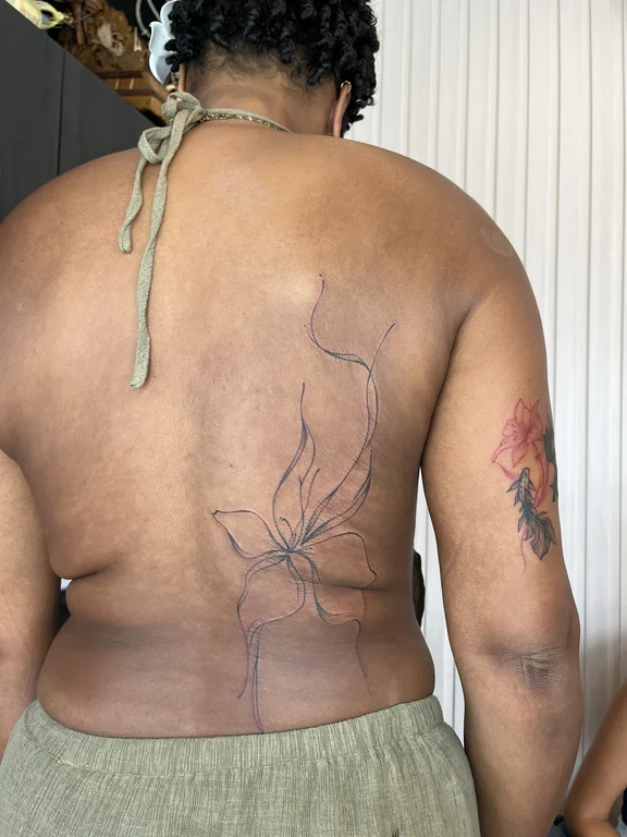 floral traditional man linework flower fine line leaf smoke tattoo Canggu Bali
