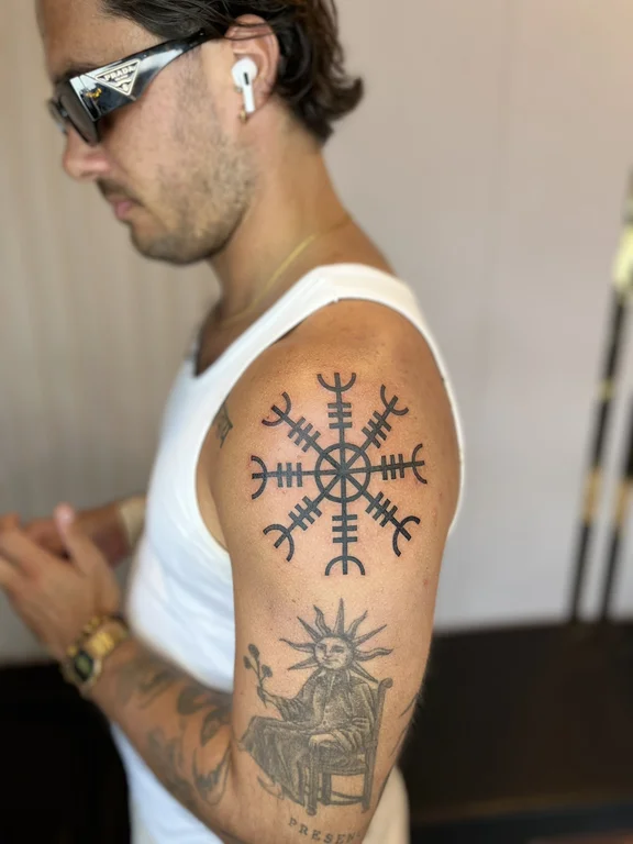geometric traditional man dotwork sun sacred geometry black grey linework tattoo Canggu Bali